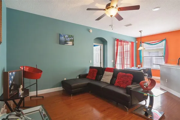 a living room with furniture and a window
