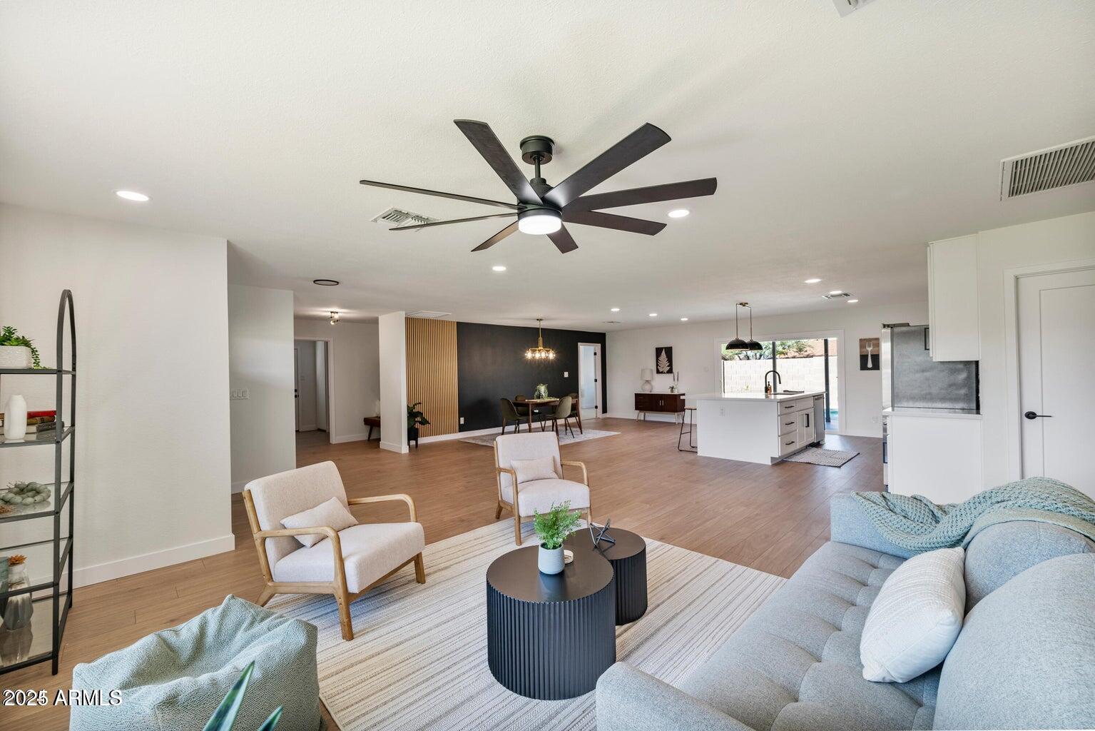 4414 South Terrace Road Tempe, AZ 85282 - Photo 12 of 24 a living room with furniture a ceiling fan and a window