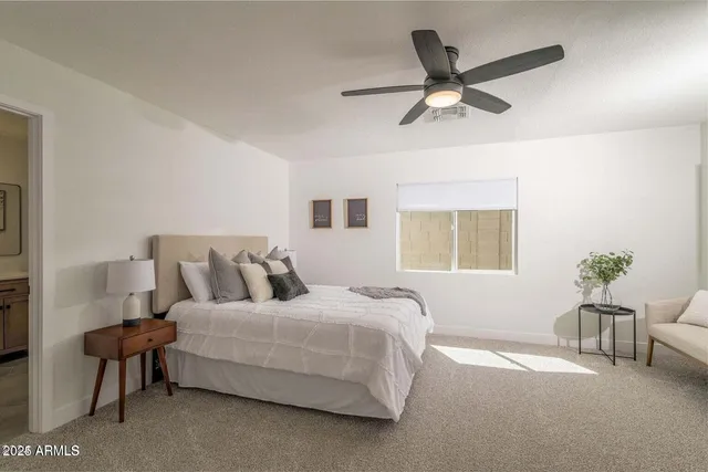 a bedroom with a bed furniture and a window
