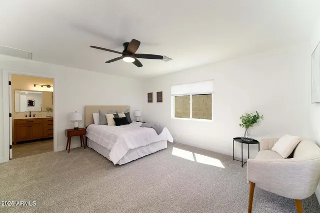 a bedroom with a bed and furniture