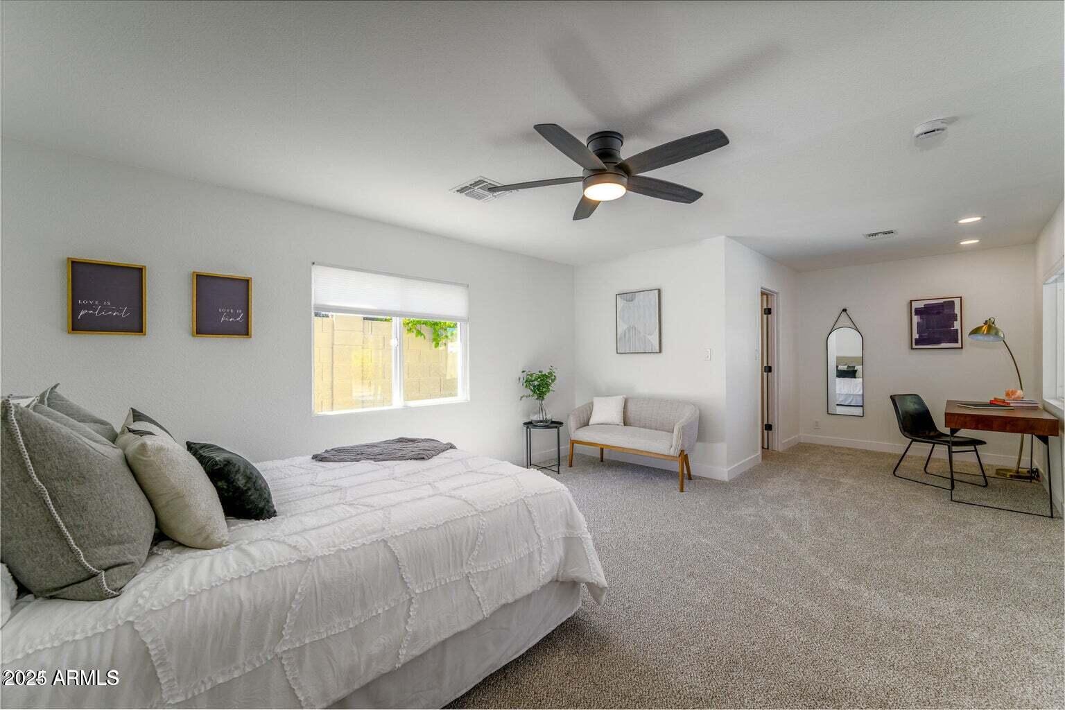 4414 South Terrace Road Tempe, AZ 85282 - Photo 16 of 24 a bedroom with a bed and a chandelier