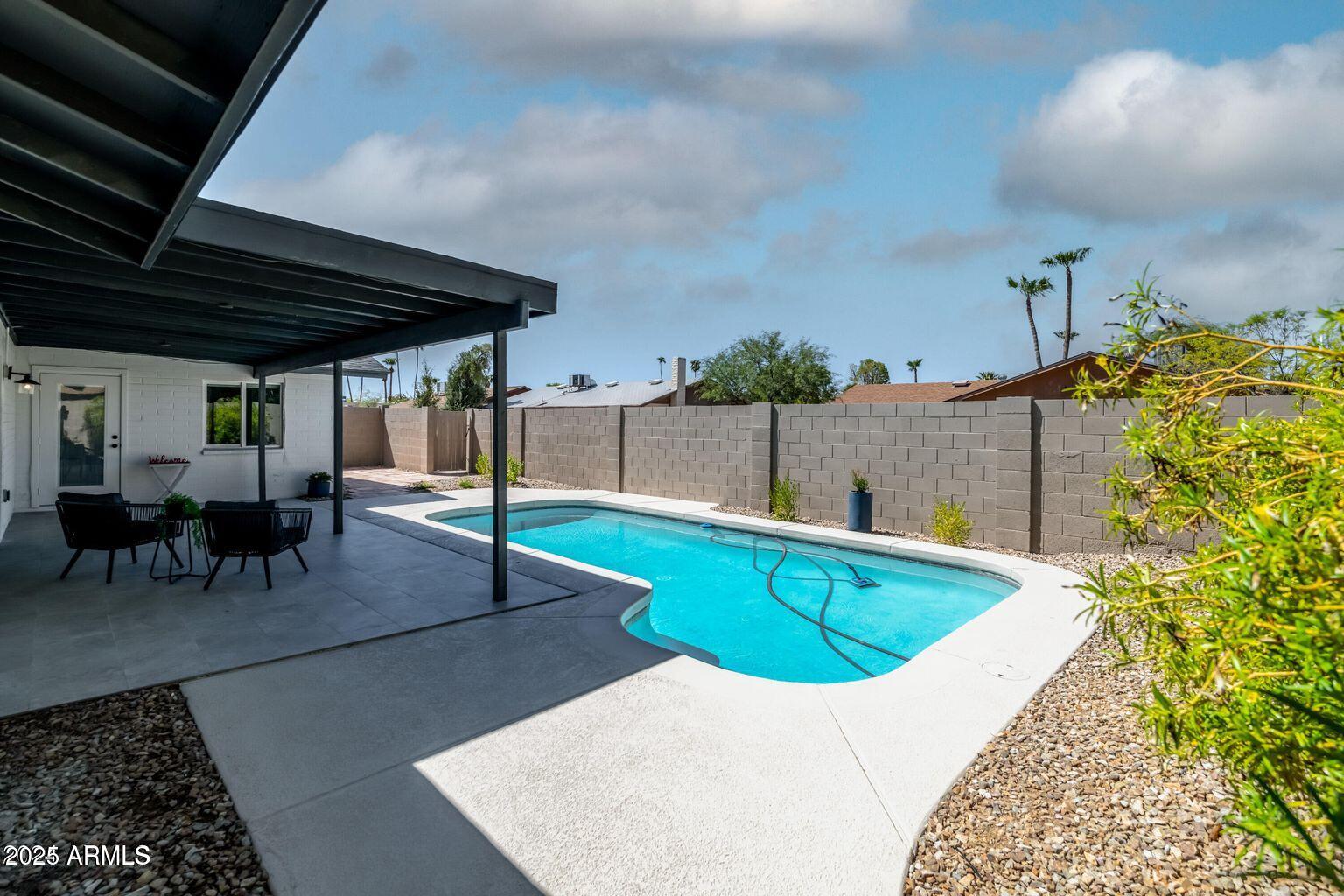 4414 South Terrace Road Tempe, AZ 85282 - Photo 22 of 24 a view of a swimming pool with a patio