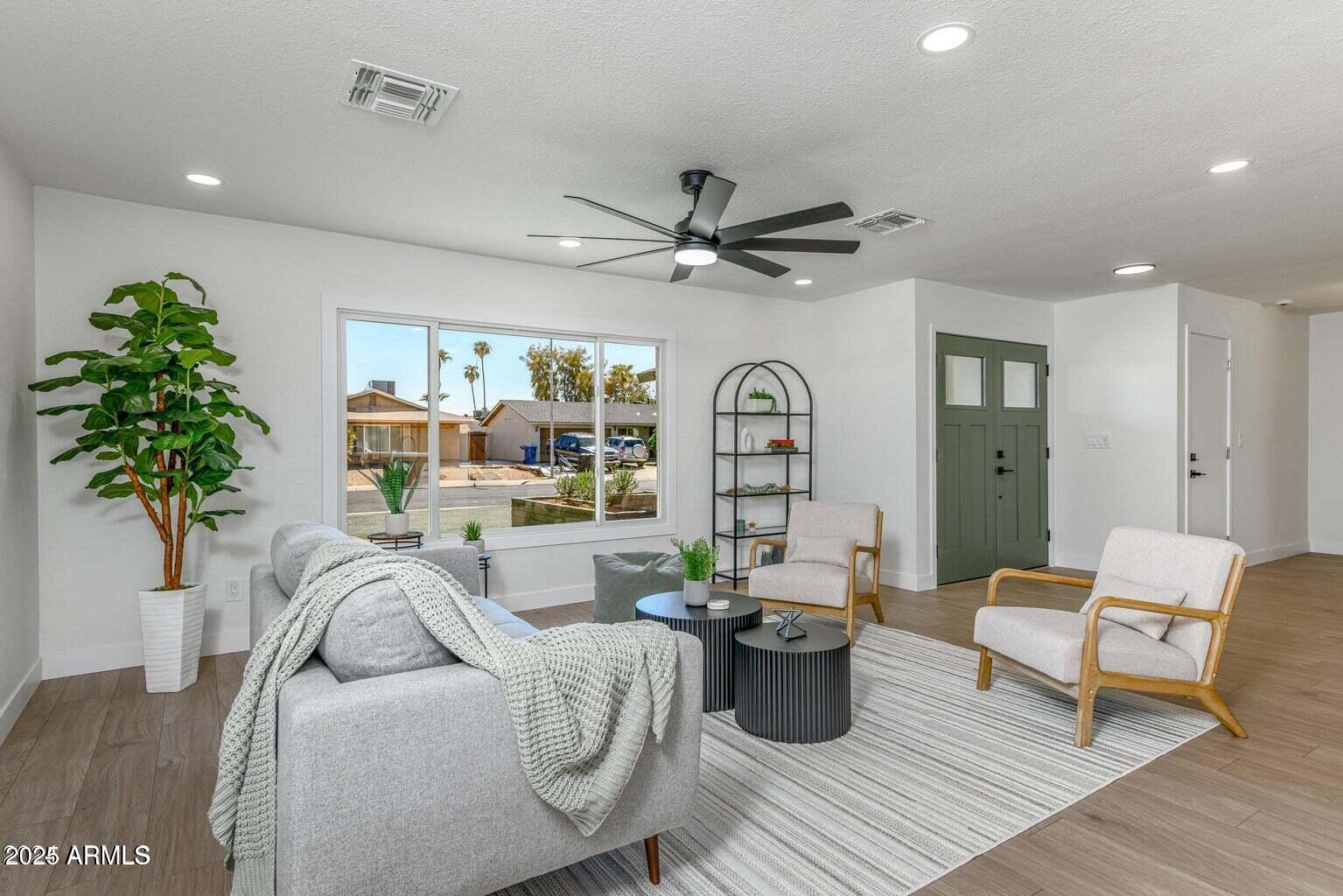 4414 South Terrace Road Tempe, AZ 85282 - Photo 4 of 24 a living room with furniture and a large window