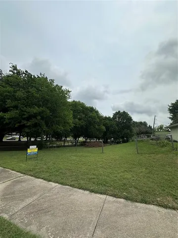 a view of a golf course with a park