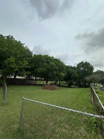 a view of a golf course with a lake