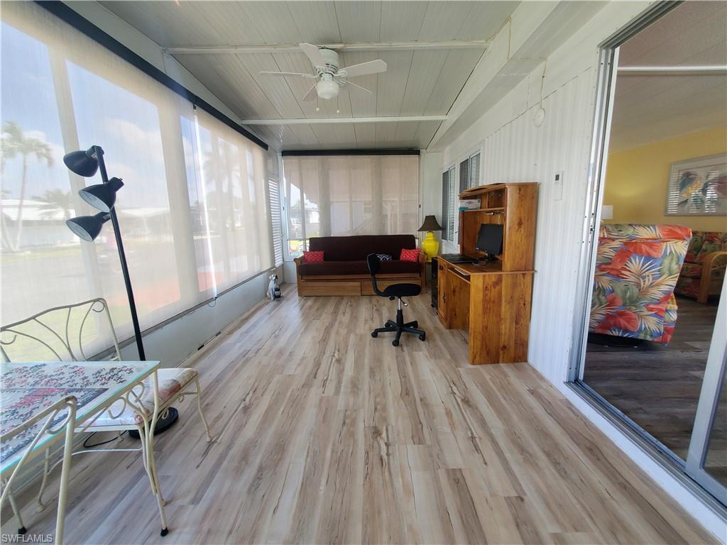 91 Enchanting Boulevard, Unit E91 Naples, FL 34112 - Photo 16 of 23 a view of a workspace with furniture and a window