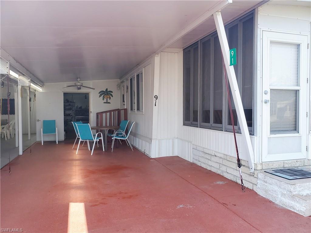 91 Enchanting Boulevard, Unit E91 Naples, FL 34112 - Photo 2 of 23 a view of a livingroom with furniture and a rug