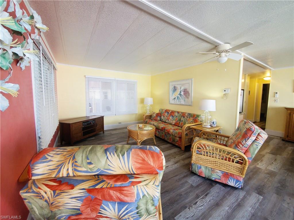 91 Enchanting Boulevard, Unit E91 Naples, FL 34112 - Photo 8 of 23 a bedroom with two beds and painting on the wall