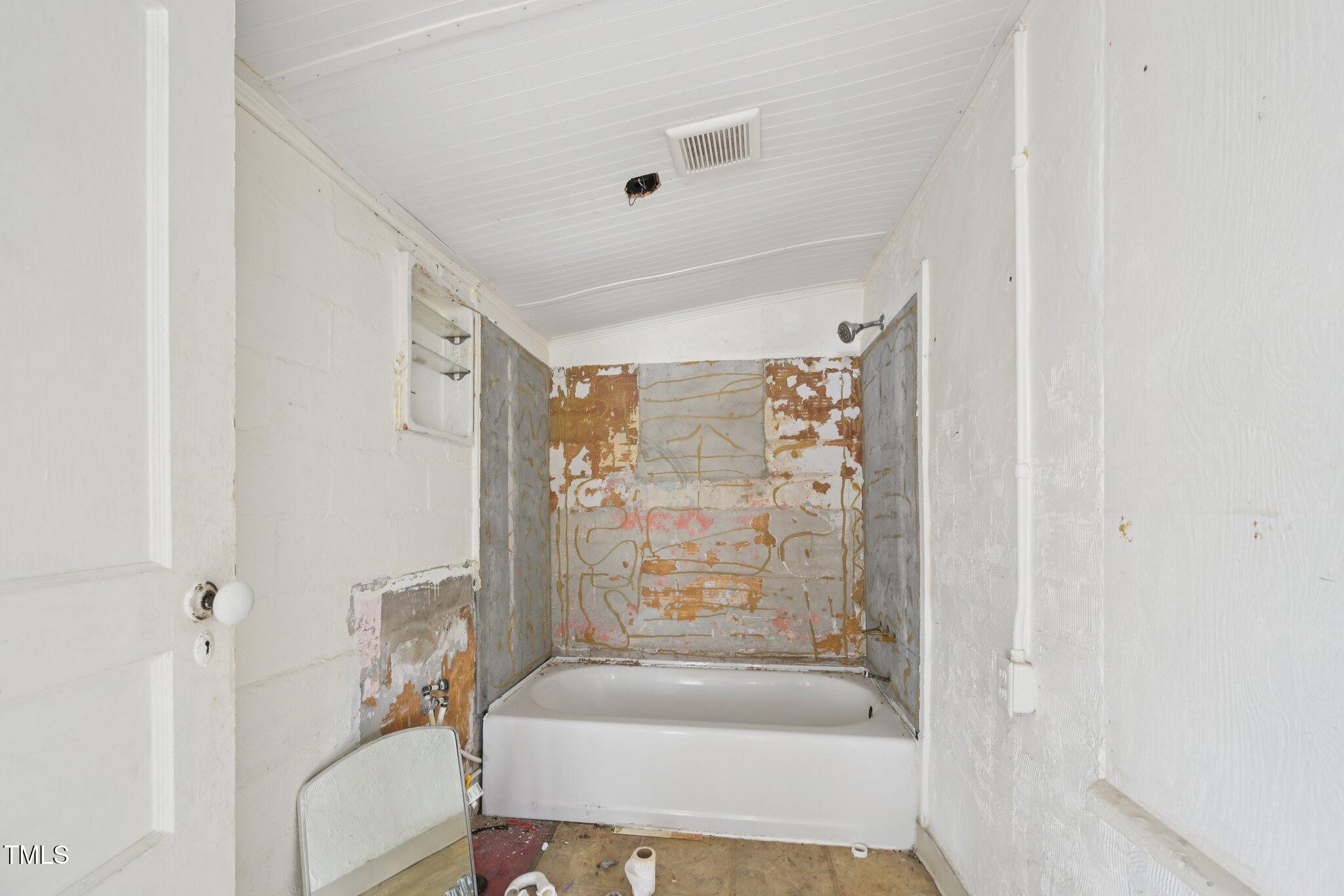 620 McAdams Road Hillsborough, NC 27278 - Photo 14 of 24 a bathroom with a bathtub and shower