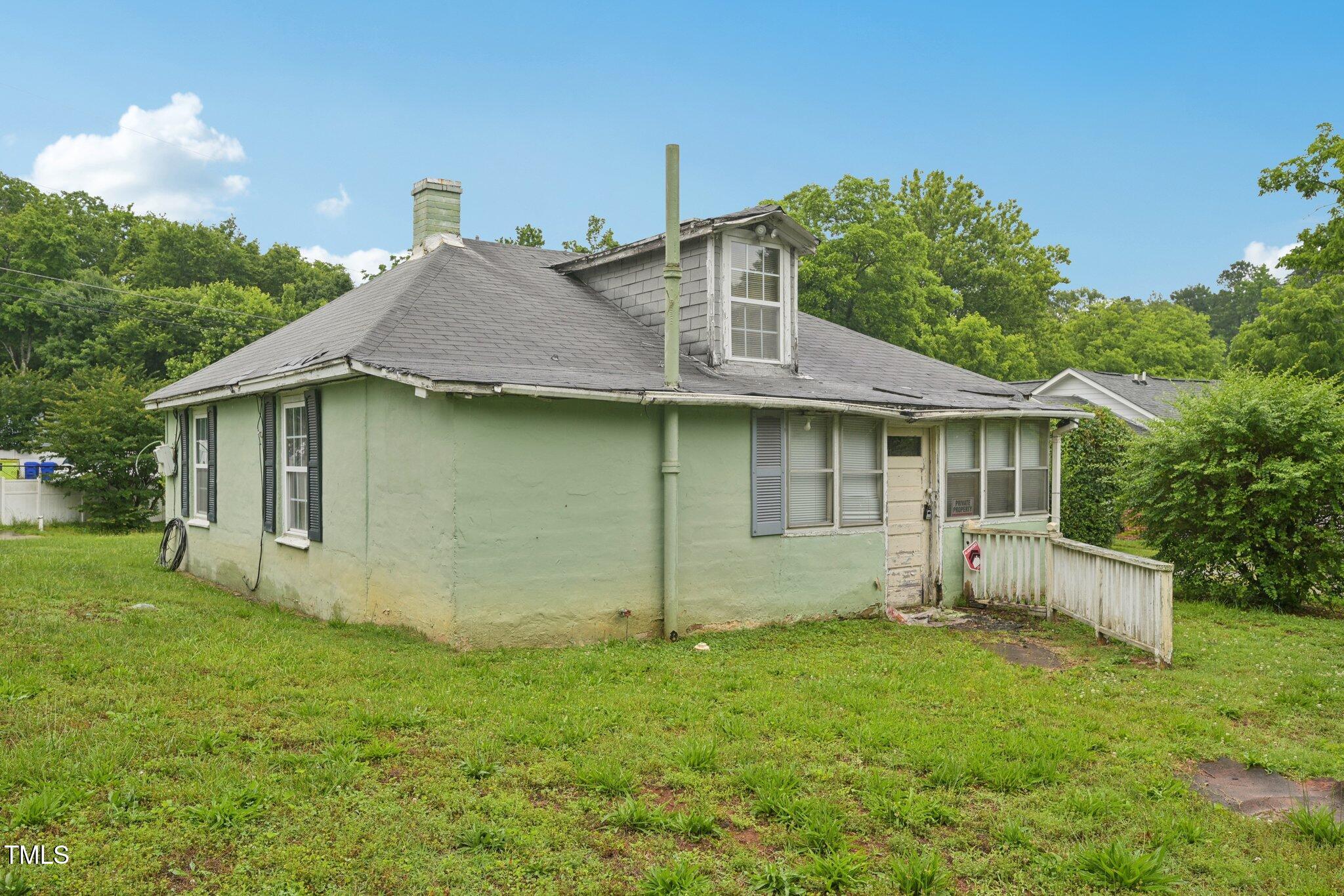 620 McAdams Road Hillsborough, NC 27278 - Photo 17 of 24 a view of a house with a yard