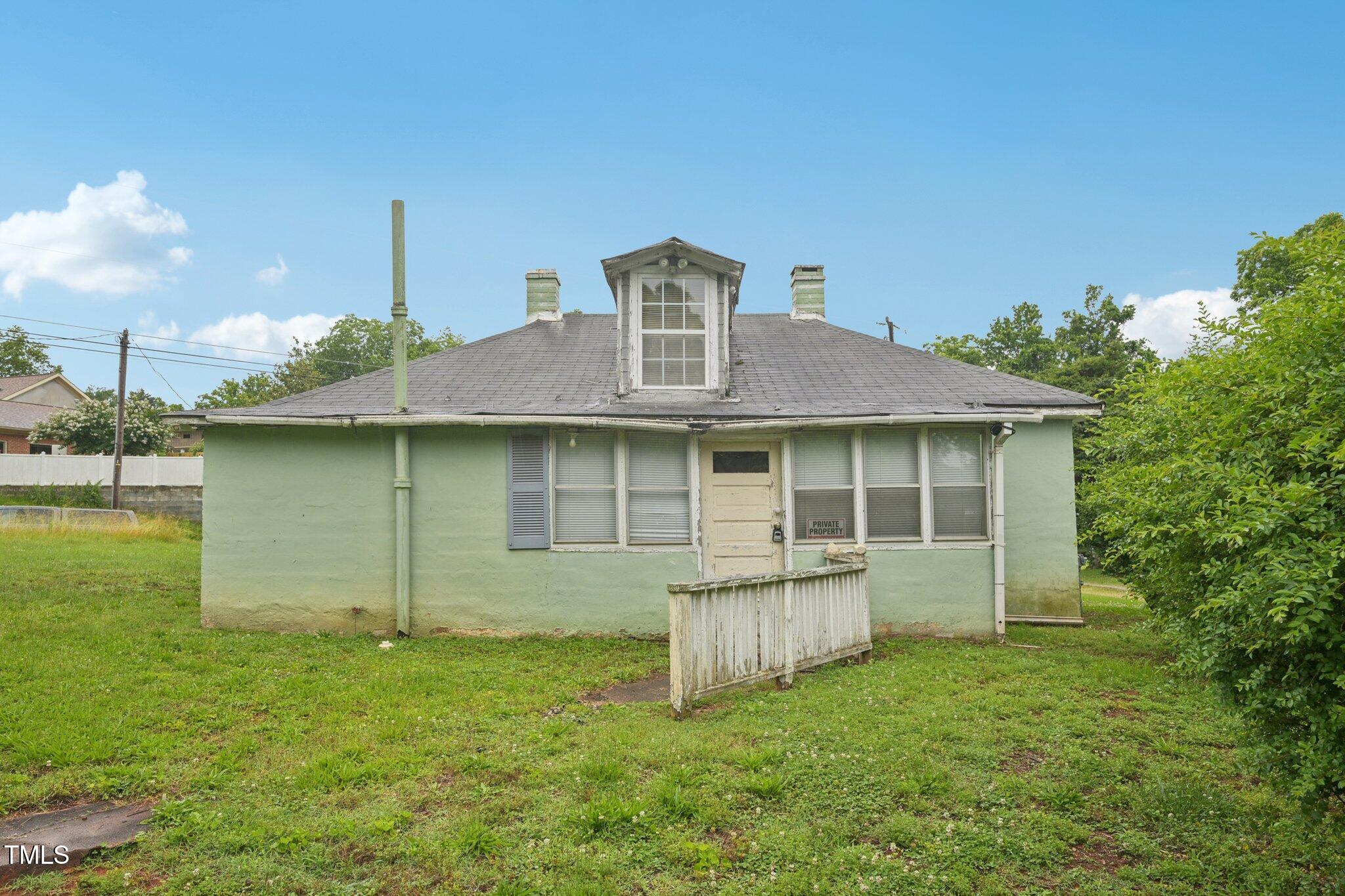 620 McAdams Road Hillsborough, NC 27278 - Photo 18 of 24 a backyard of a house with table and chairs