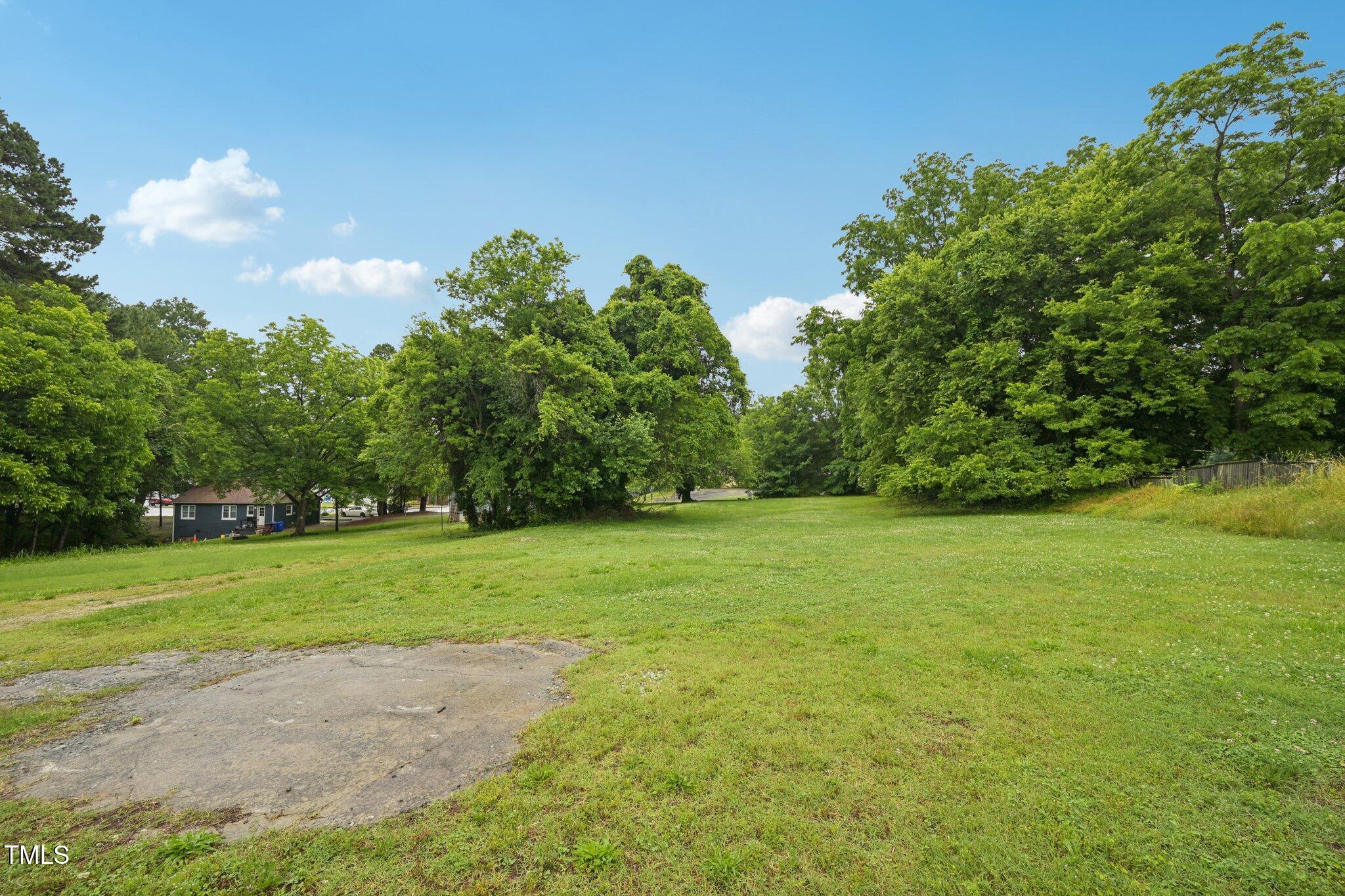620 McAdams Road Hillsborough, NC 27278 - Photo 19 of 24 a view of a field of grass and trees