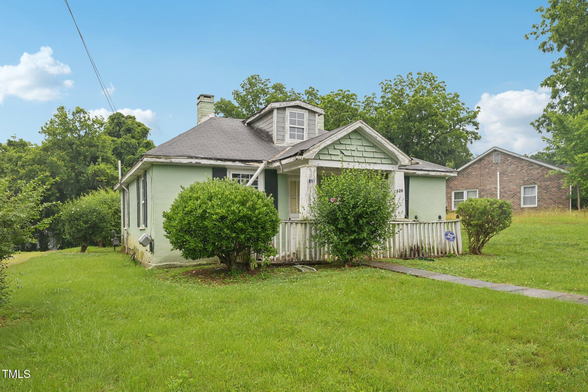 620 McAdams Road Hillsborough, NC 27278 - Photo 4 of 24 a front view of a house with garden