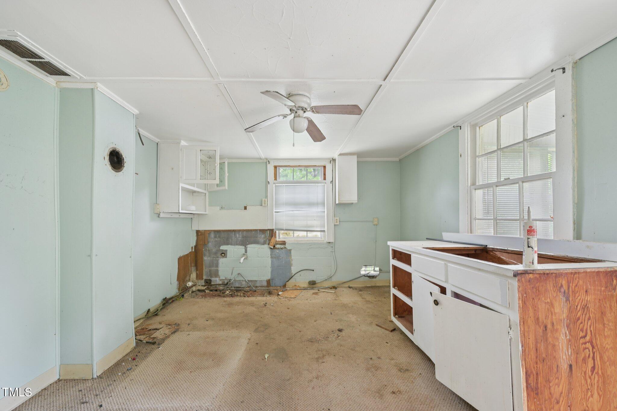 620 McAdams Road Hillsborough, NC 27278 - Photo 6 of 24 a room with a stove and a chandelier