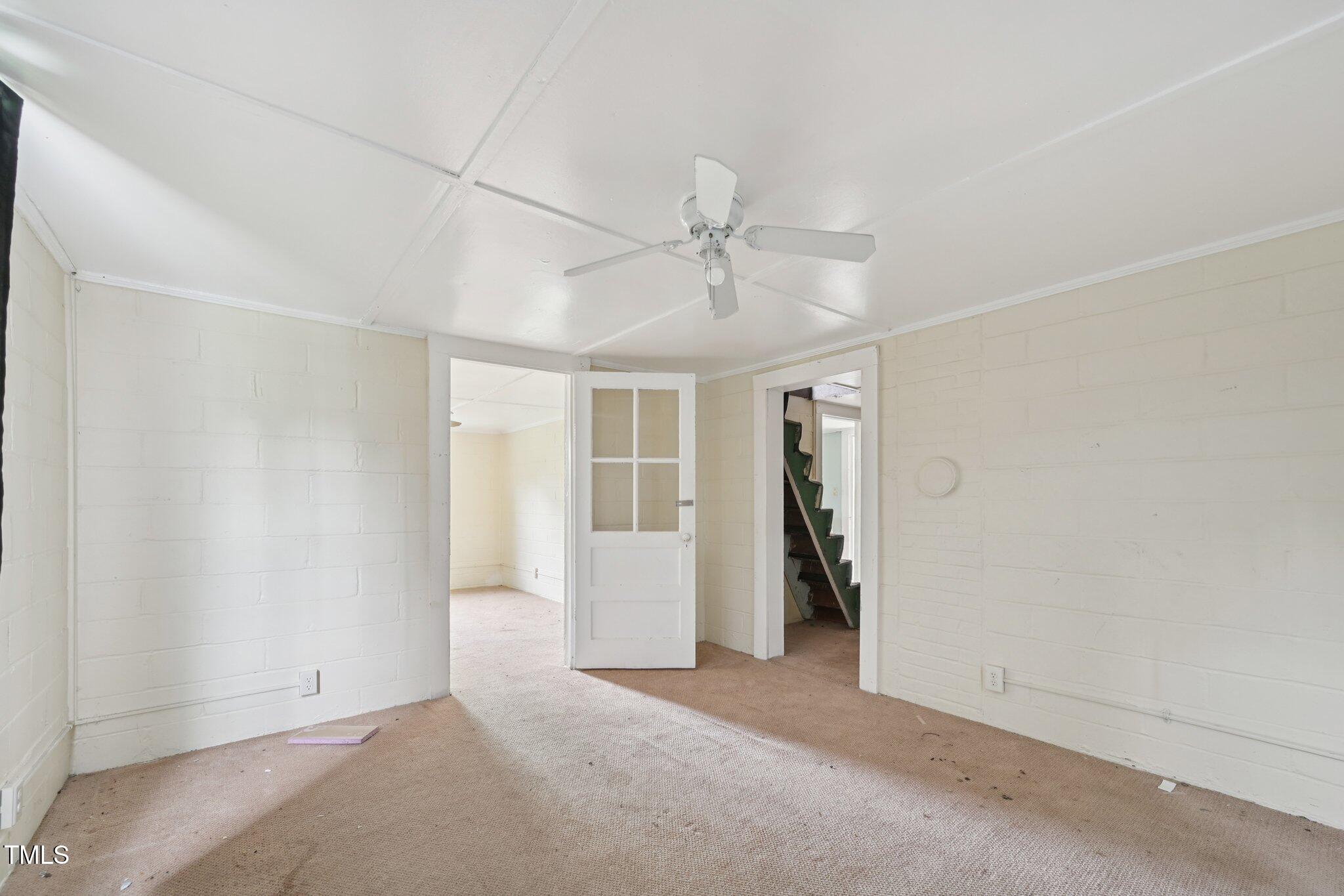 620 McAdams Road Hillsborough, NC 27278 - Photo 9 of 24 an empty room with closet and a ceiling fan