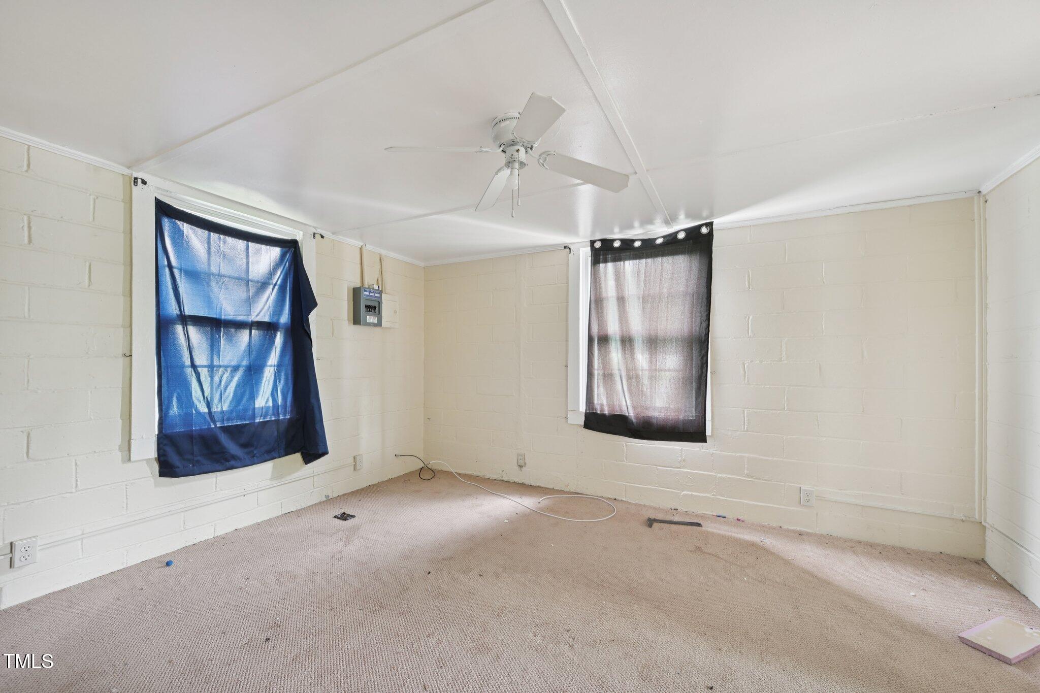 620 McAdams Road Hillsborough, NC 27278 - Photo 10 of 24 an empty room with windows and cabinet