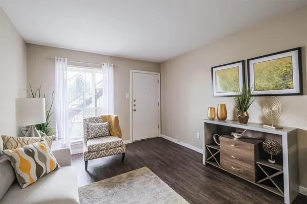a living room with furniture and a window