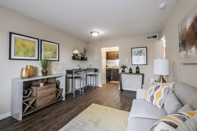 a living room with furniture and a flat screen tv