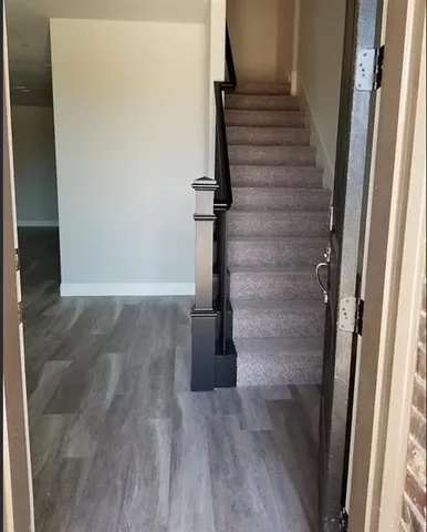 a view of entryway with wooden floor