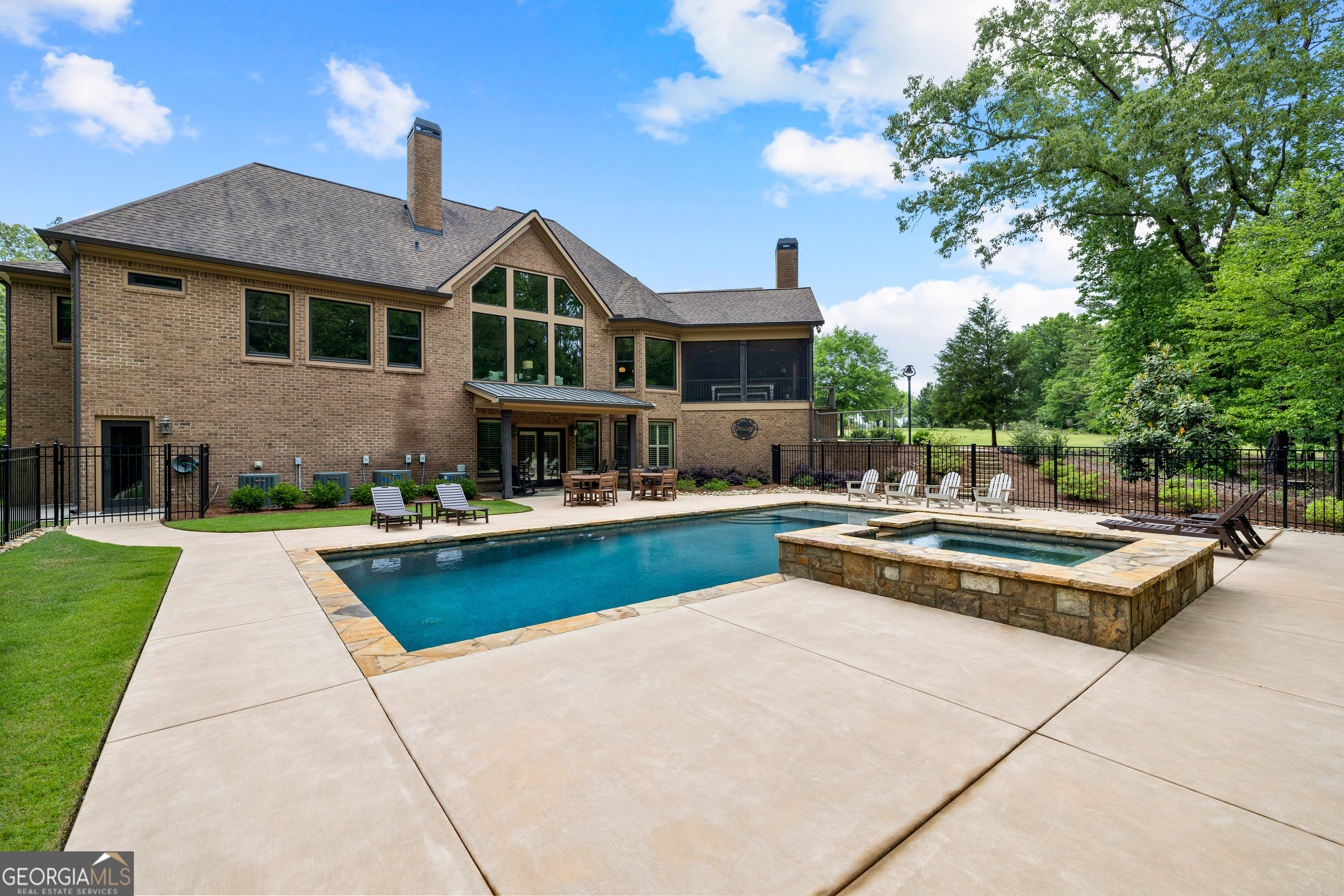 752 Grant Road Brooks, GA 30205 - Photo 101 of 132 a front view of a house with swimming pool and sitting area