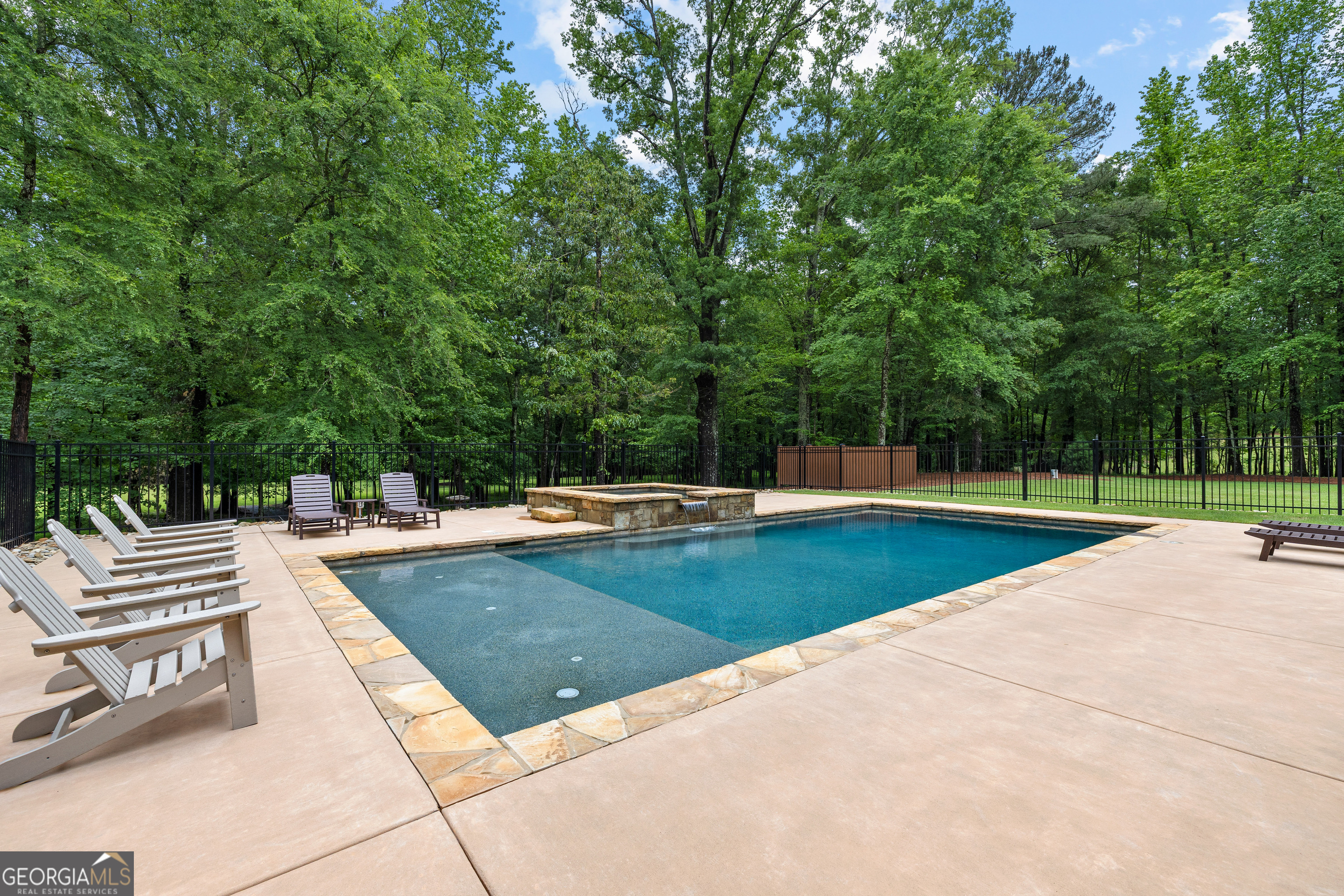 752 Grant Road Brooks, GA 30205 - Photo 108 of 132 a view of a swimming pool with a patio