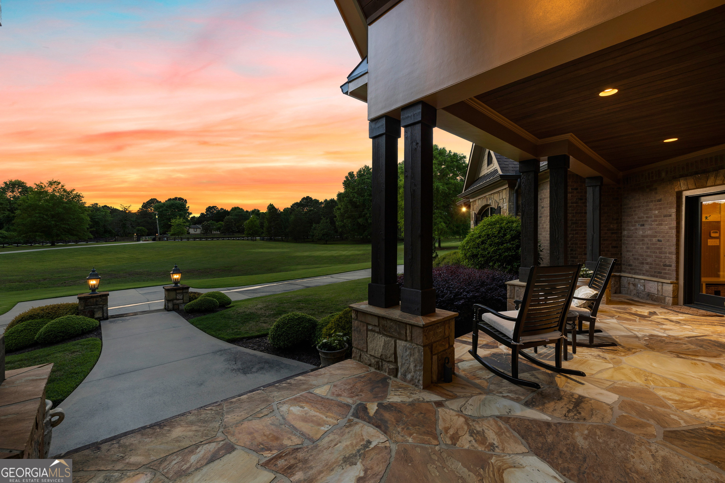 752 Grant Road Brooks, GA 30205 - Photo 15 of 132 a view of a patio with table and chairs couches plants and large trees