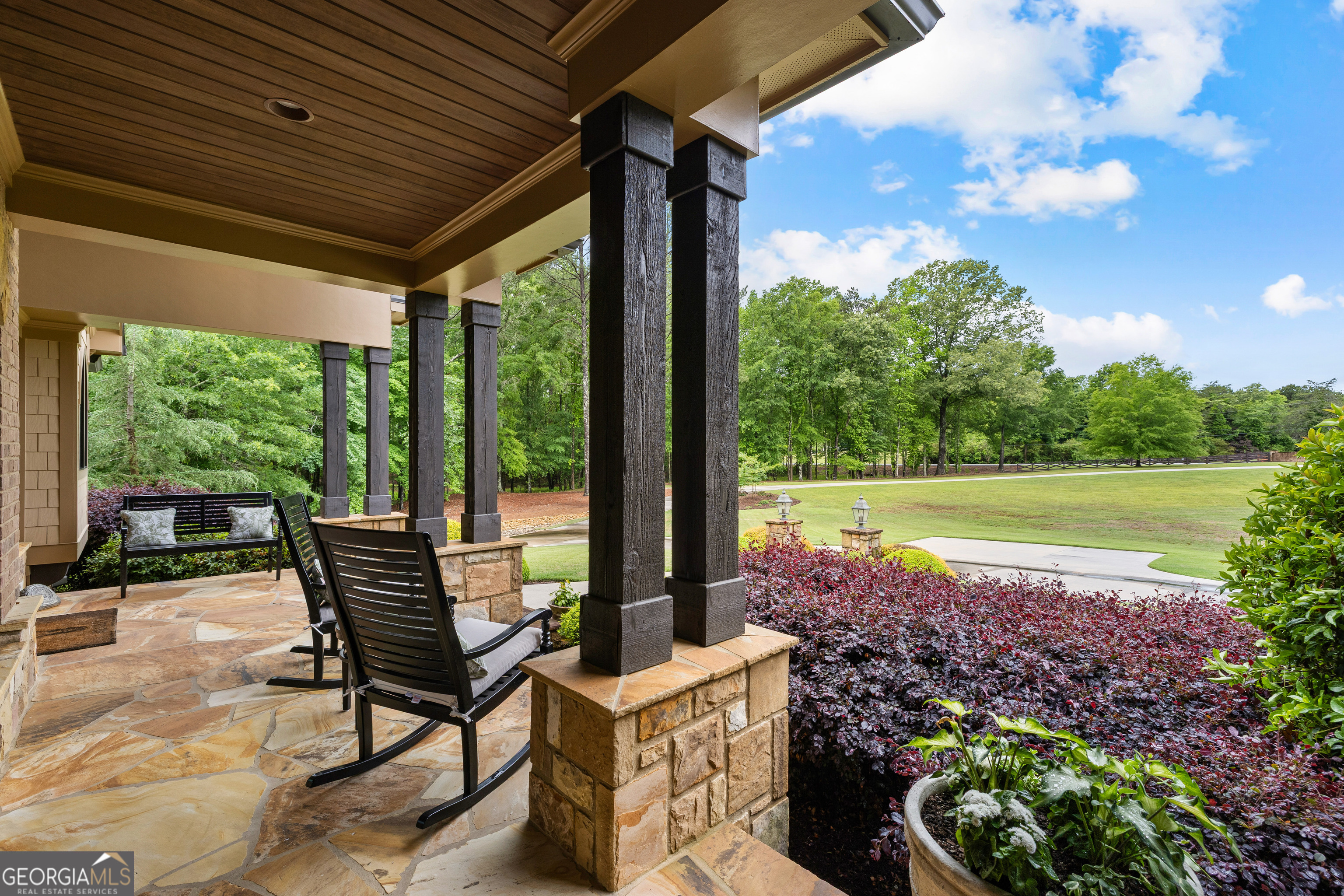 752 Grant Road Brooks, GA 30205 - Photo 17 of 132 a view of a patio with table and chairs potted plants and floor to ceiling window