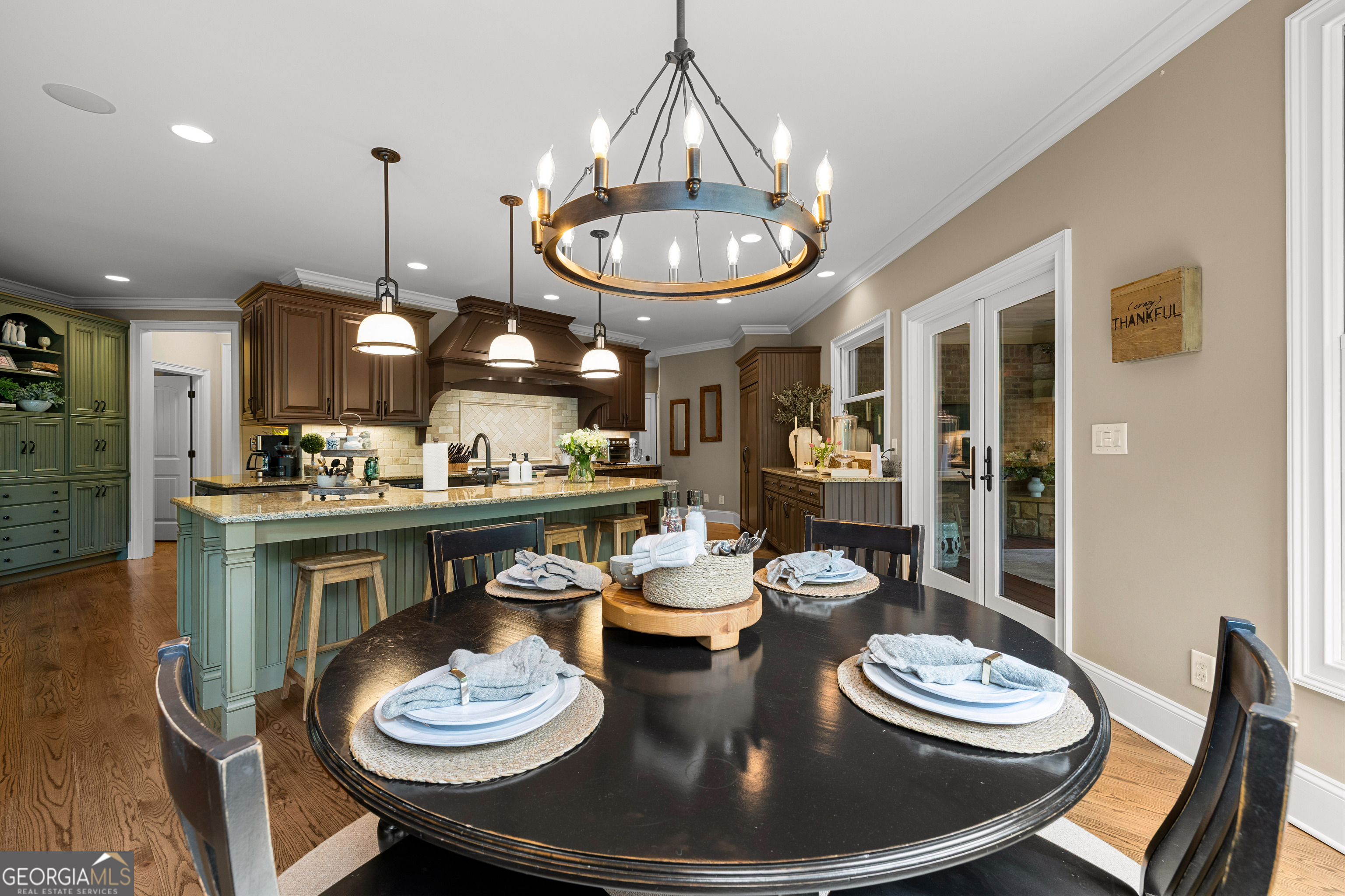 752 Grant Road Brooks, GA 30205 - Photo 39 of 132 a kitchen with stainless steel appliances a dining table and chairs