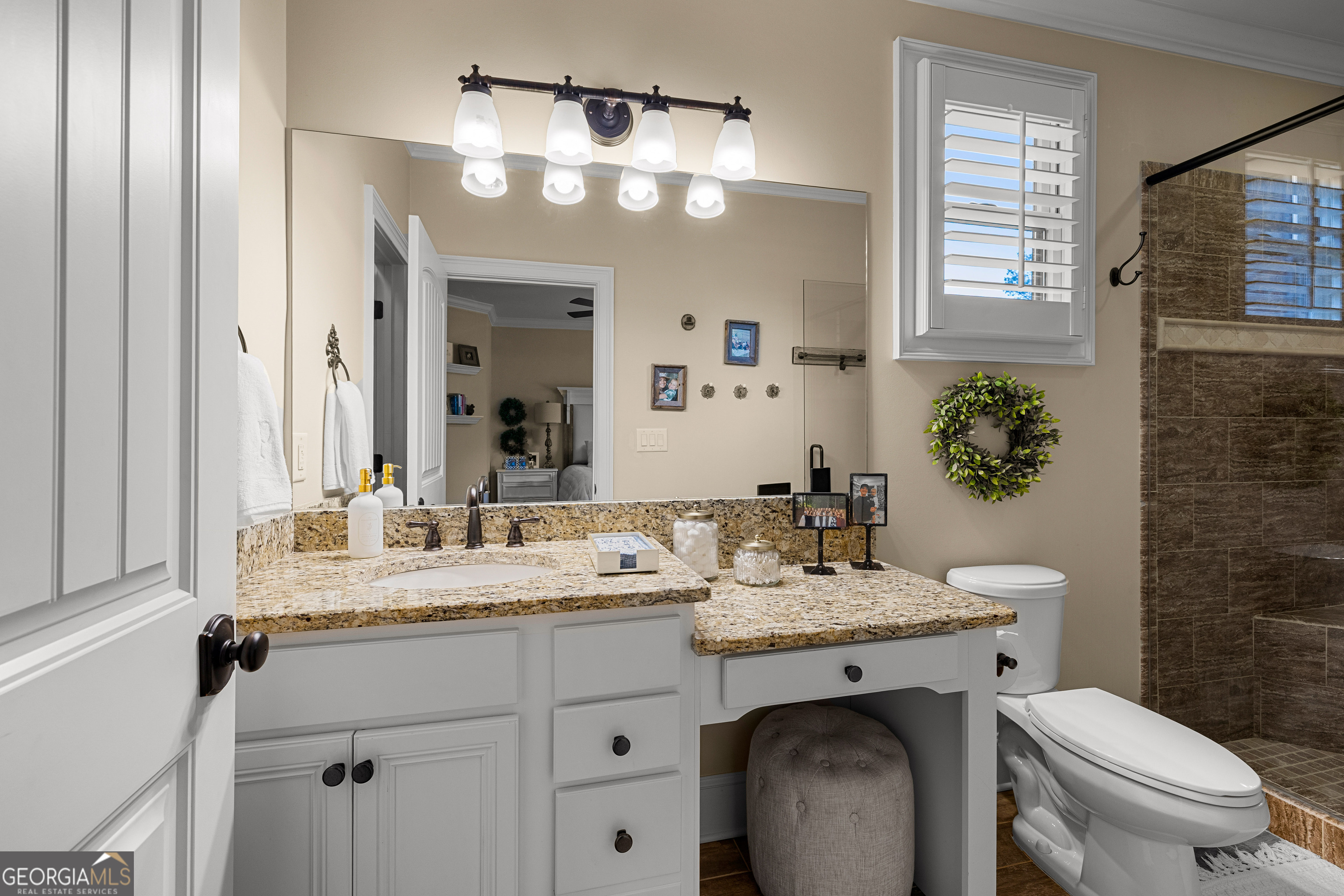 752 Grant Road Brooks, GA 30205 - Photo 58 of 132 a bathroom with a sink vanity granite toilet and a mirror