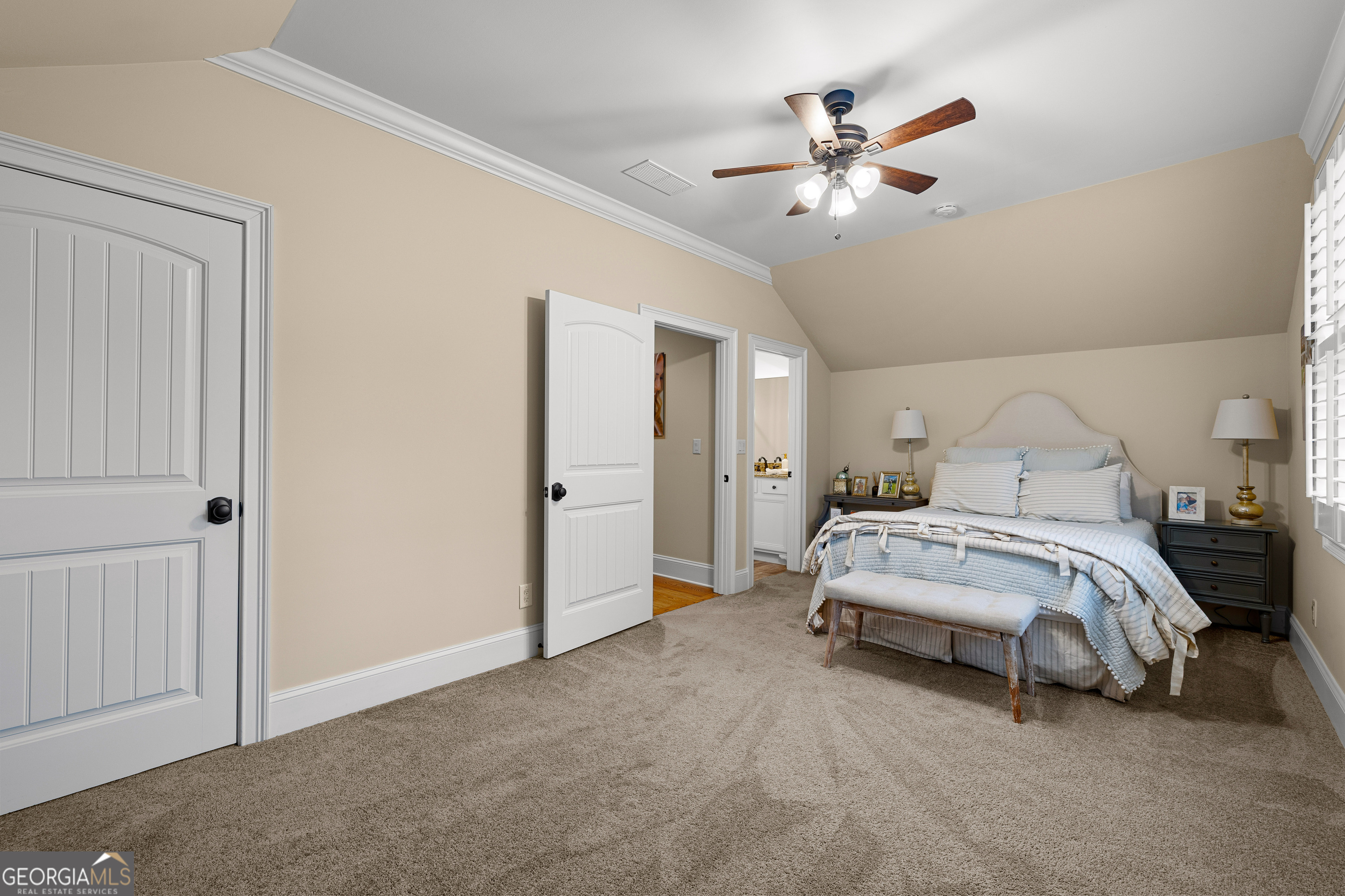 752 Grant Road Brooks, GA 30205 - Photo 64 of 132 a spacious bedroom with a bed and a ceiling fan