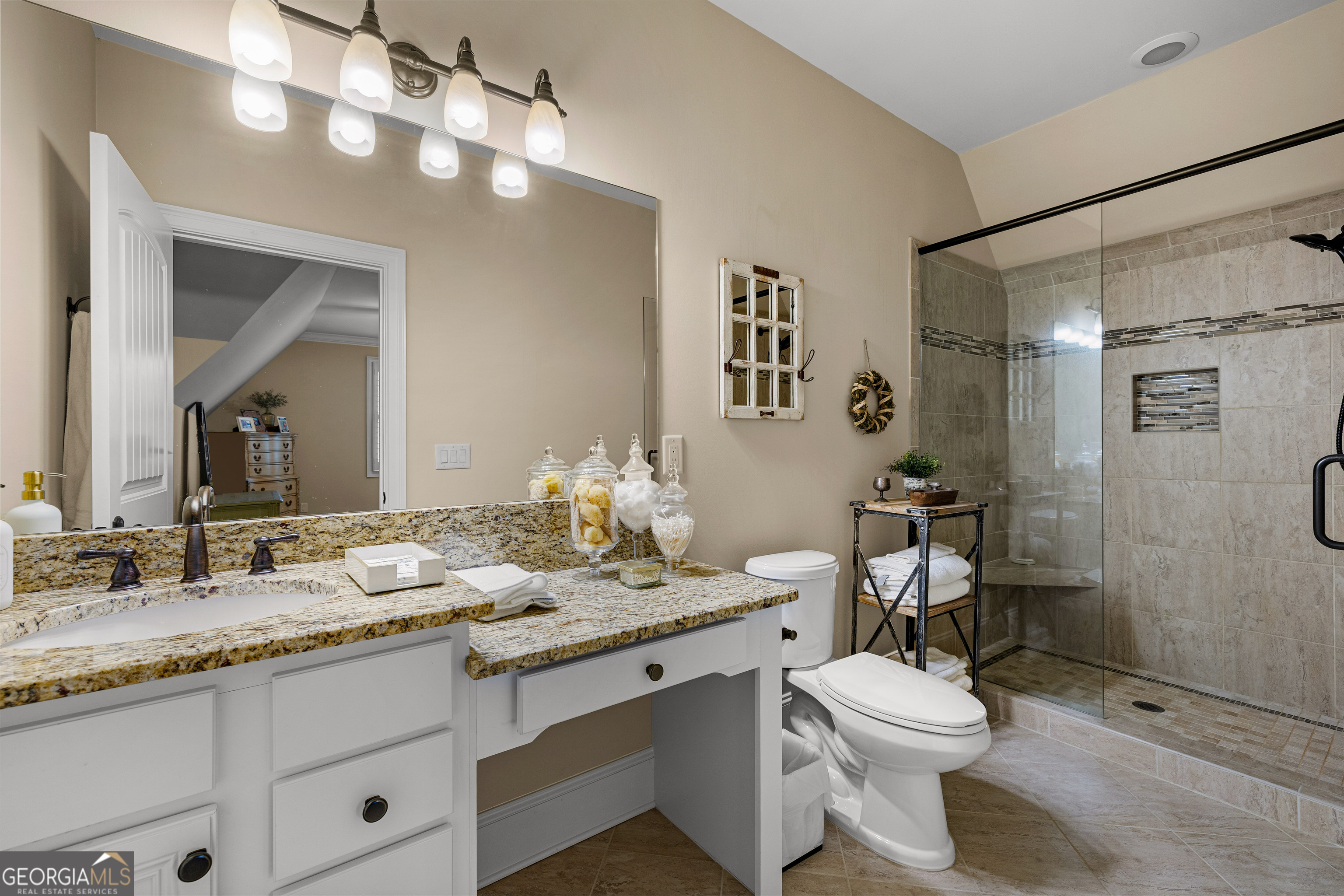 752 Grant Road Brooks, GA 30205 - Photo 73 of 132 a bathroom with a granite countertop sink mirror vanity and toilet