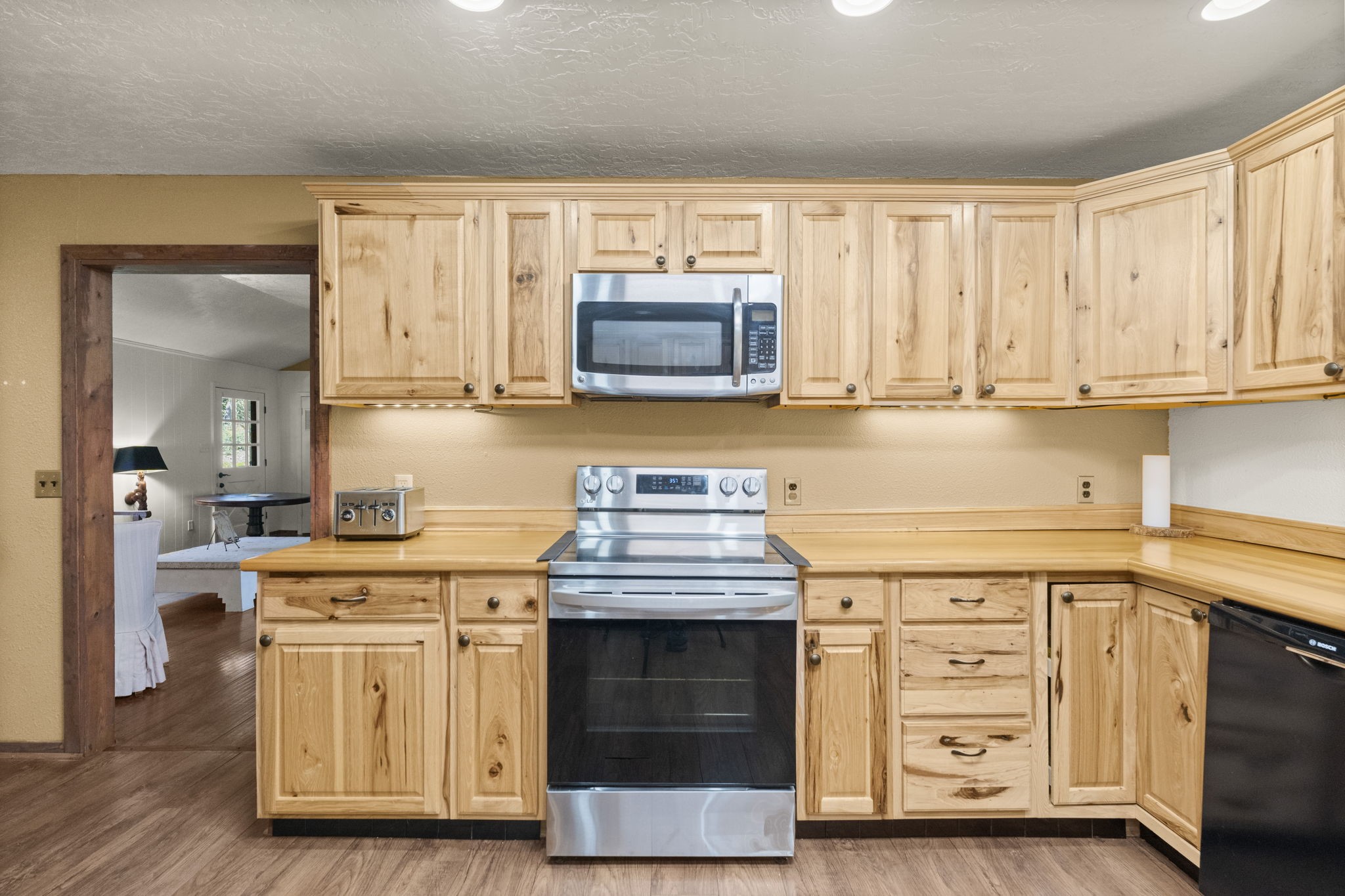 114 Hillendale Street Livingston, TX 77351 - Photo 18 of 46 a kitchen with stainless steel appliances granite countertop a stove and cabinets