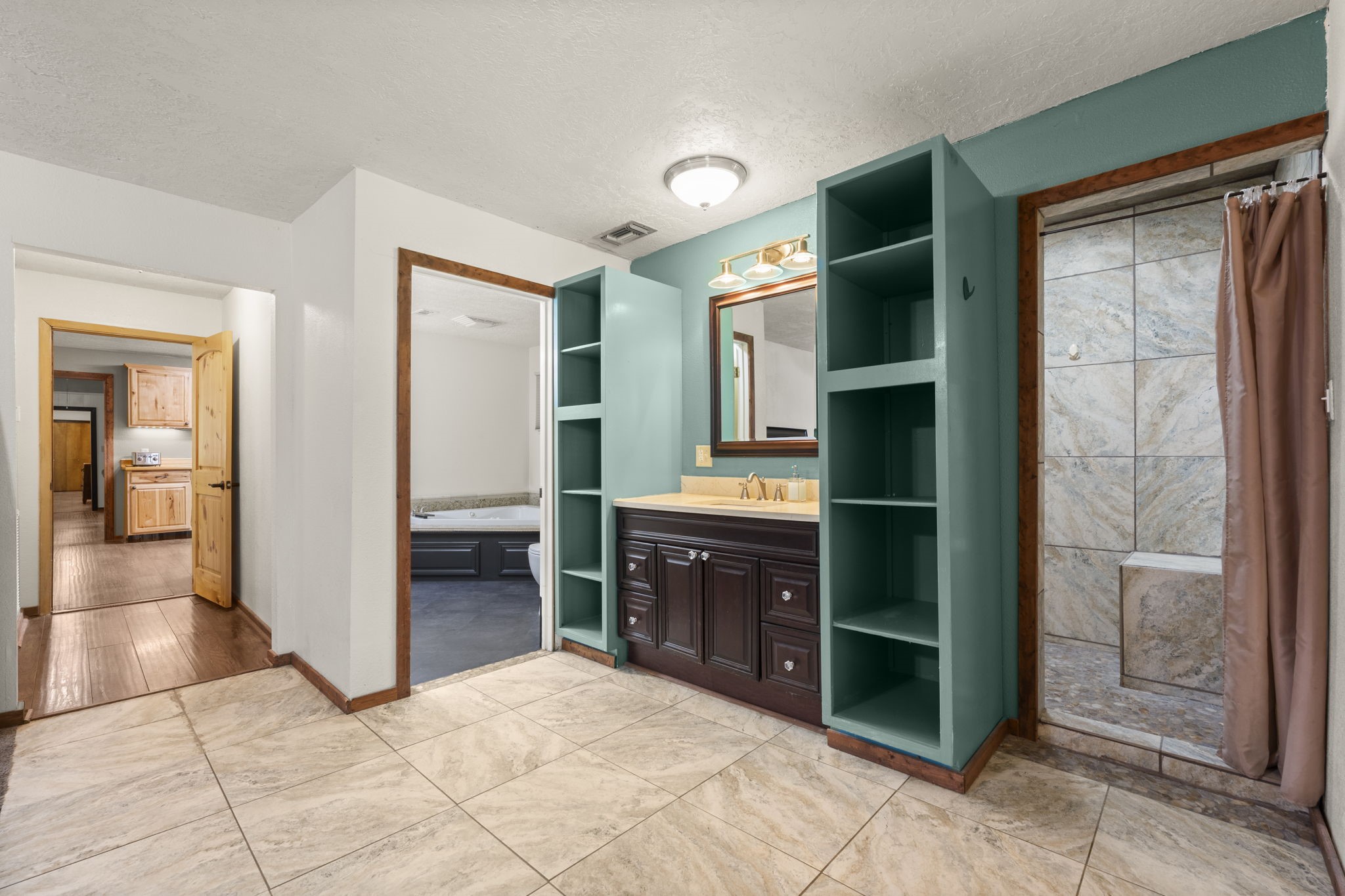 114 Hillendale Street Livingston, TX 77351 - Photo 26 of 46 a spacious bathroom with a shower and a sink