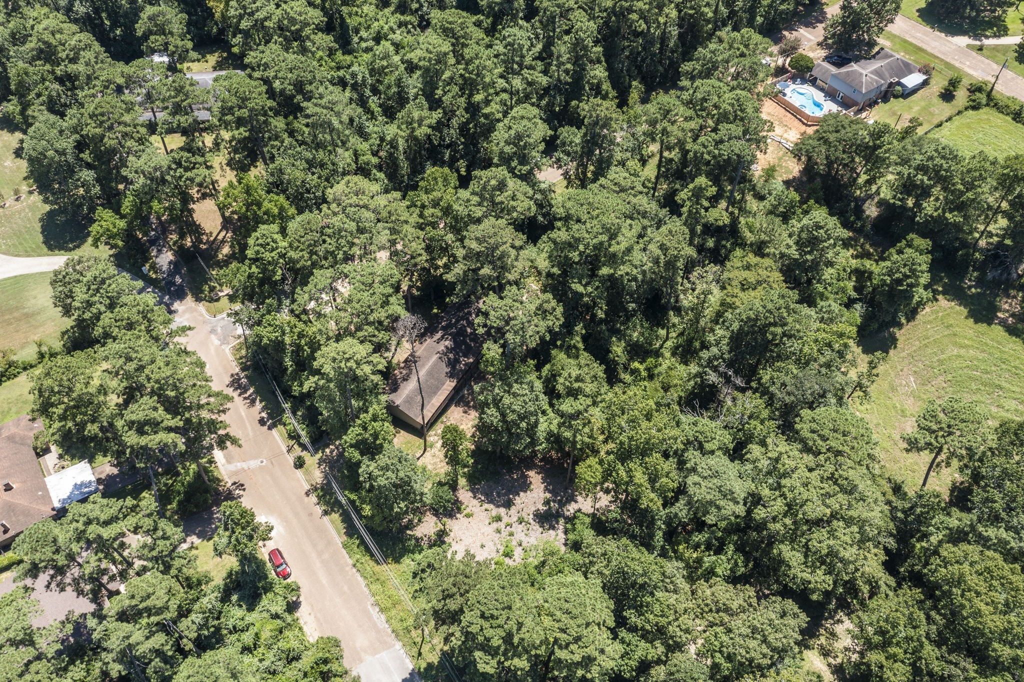 114 Hillendale Street Livingston, TX 77351 - Photo 43 of 46 an aerial view of residential houses with outdoor space and trees