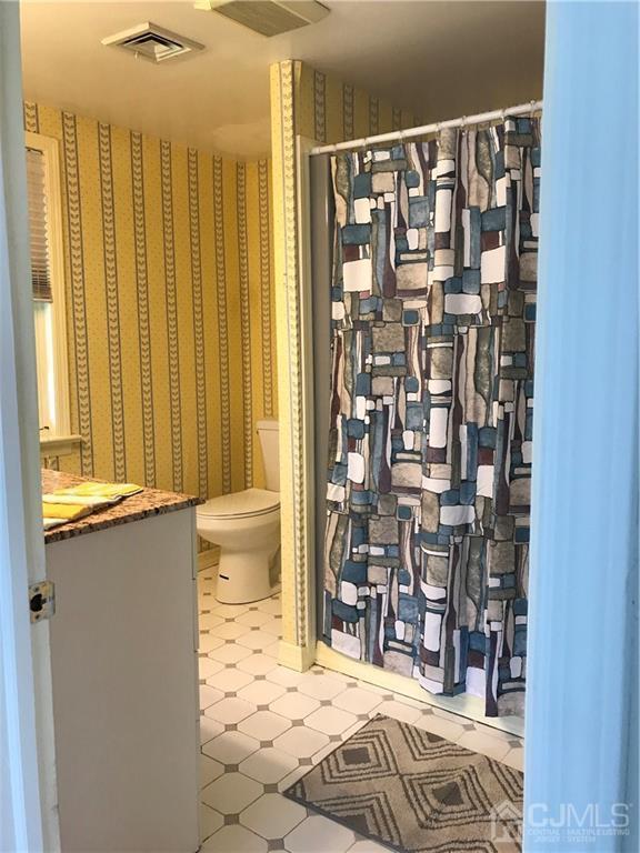 398 Ridge Road Dayton, NJ 08810 - Photo 5 of 19 a bedroom with a bed and a window