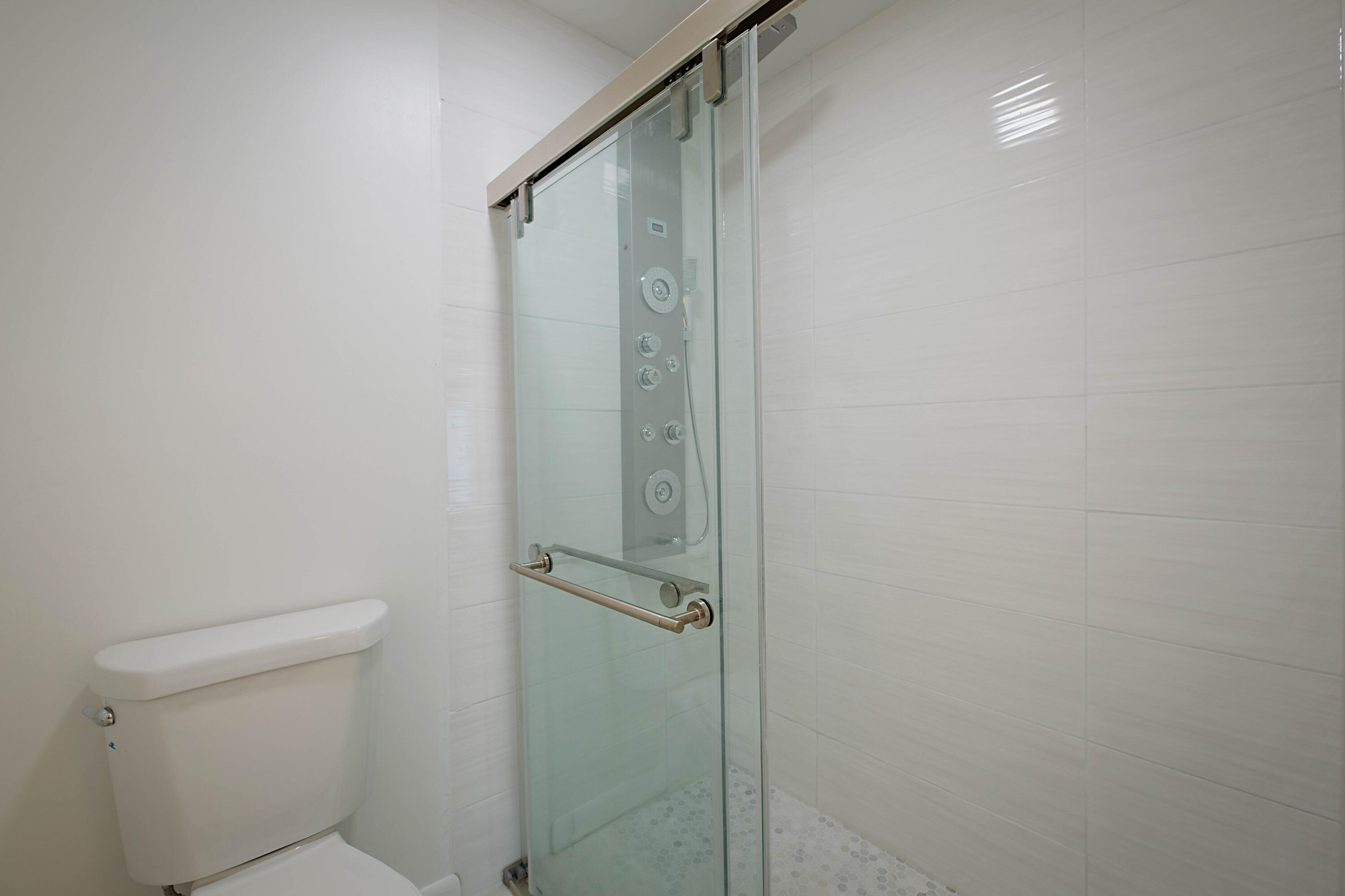 903 Harbour Pointe Way Greenacres, FL 33413 - Photo 13 of 26 a bathroom with a shower and a toilet