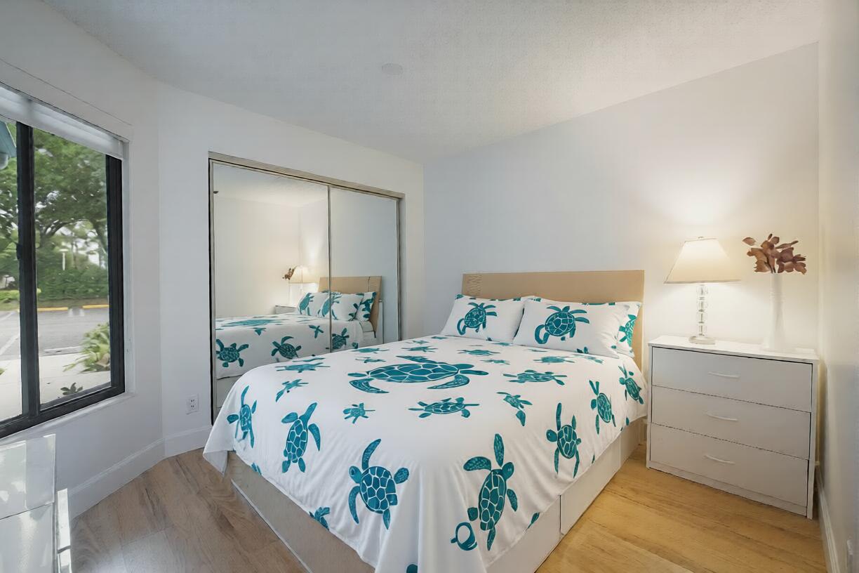 903 Harbour Pointe Way Greenacres, FL 33413 - Photo 15 of 26 a bedroom with a bed and window