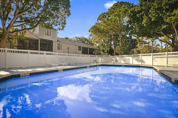 an aerial view of a pool patio swimming pool and outdoor seating