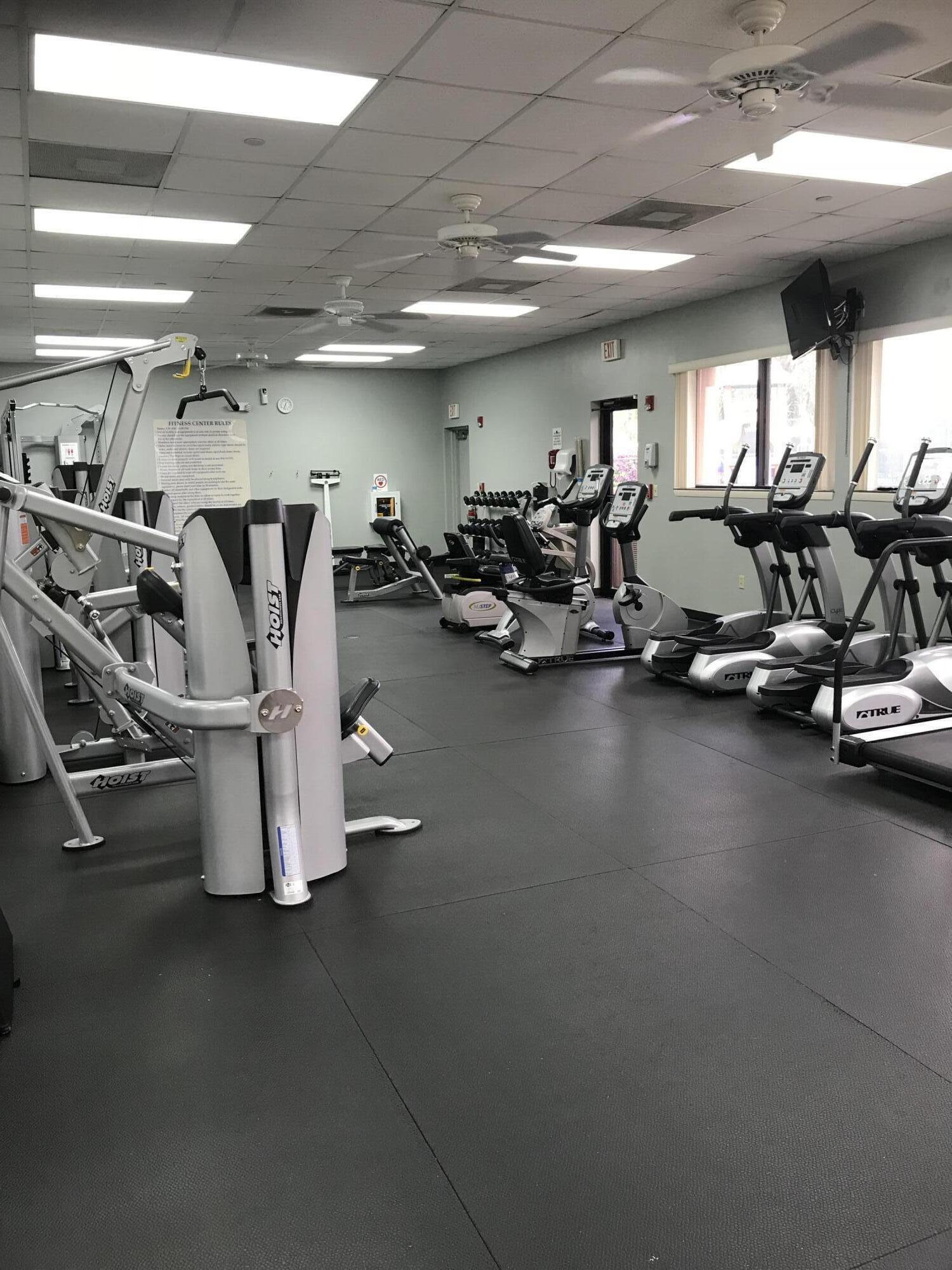 903 Harbour Pointe Way Greenacres, FL 33413 - Photo 22 of 26 a view of a room with gym equipment