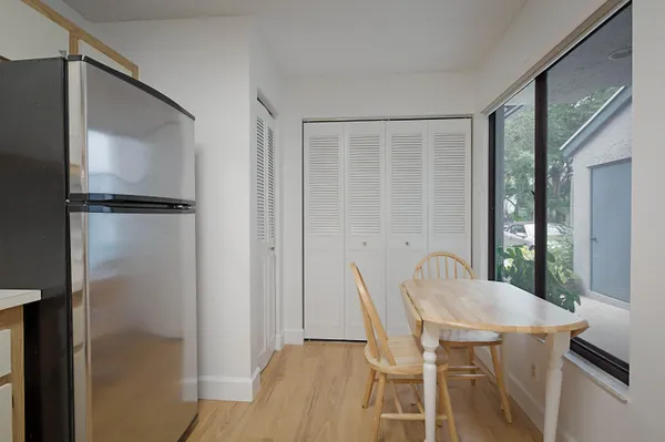 a view of a dining room with furniture window and wooden floor