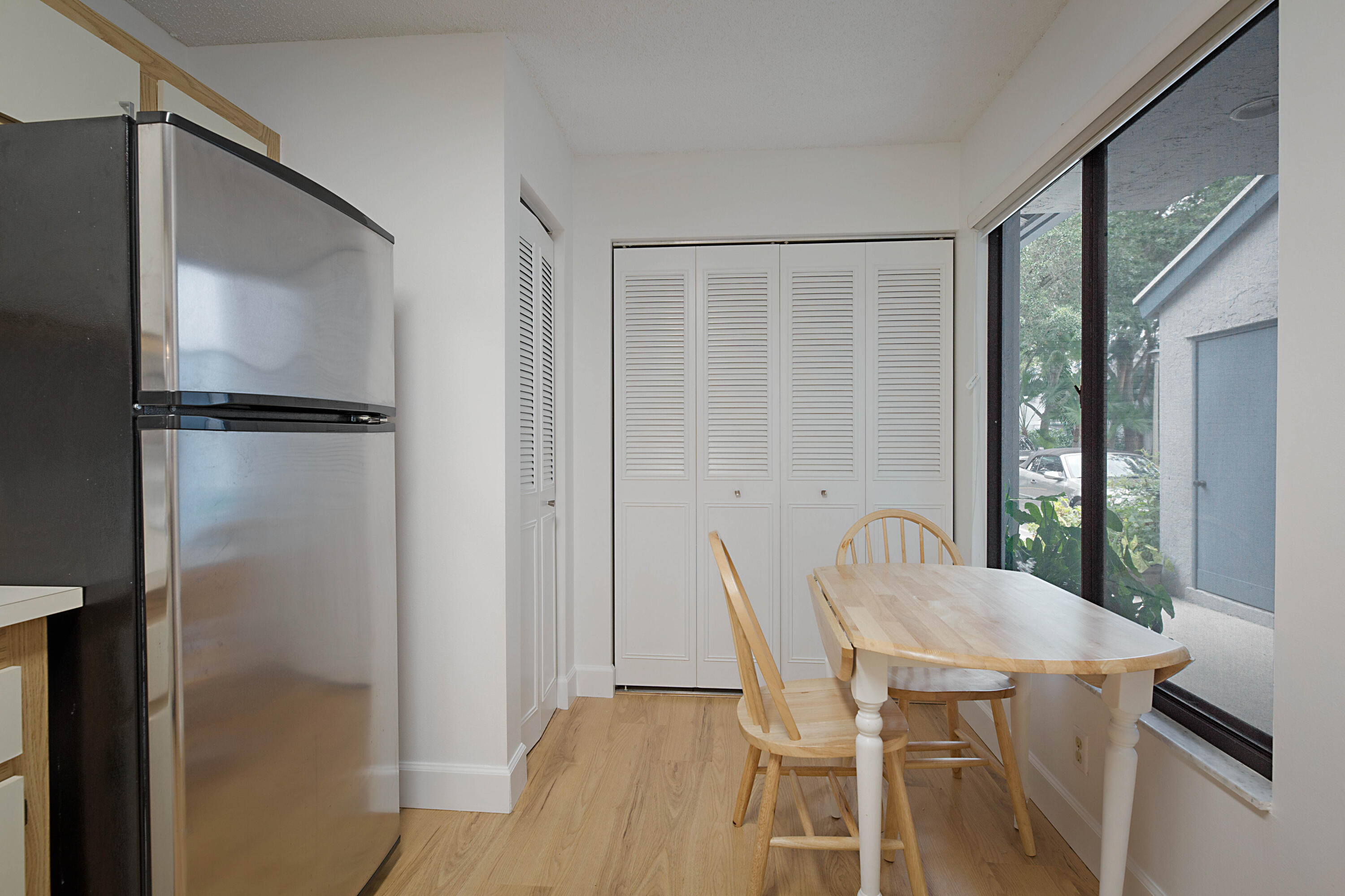 903 Harbour Pointe Way Greenacres, FL 33413 - Photo 4 of 26 a view of a dining room with furniture window and wooden floor