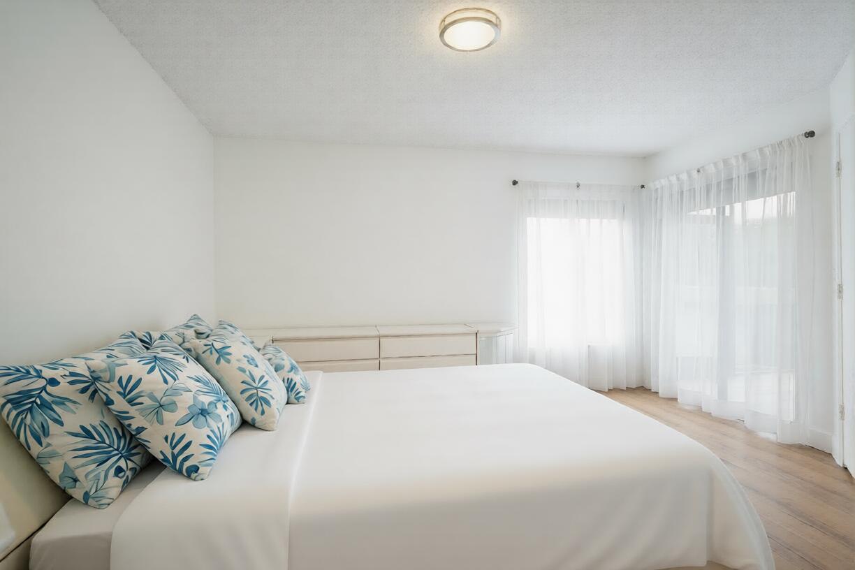 903 Harbour Pointe Way Greenacres, FL 33413 - Photo 10 of 26 a bedroom with a bed and a window