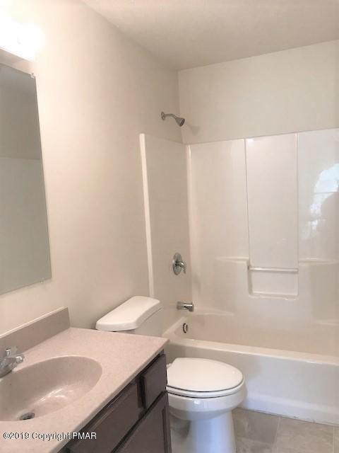 6305 Laurel Road Pocono Summit, PA 18346 - Photo 11 of 13 a bathroom with a sink toilet and shower