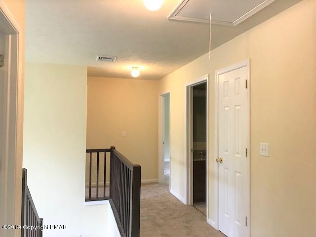 6305 Laurel Road Pocono Summit, PA 18346 - Photo 8 of 13 a view of a hallway with a room