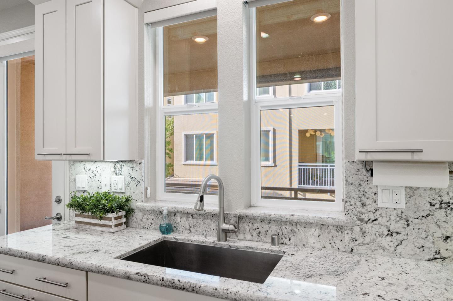5977 Larkstone Loop San Jose, CA 95123 - Photo 22 of 63 a bathroom with a granite countertop sink and a window