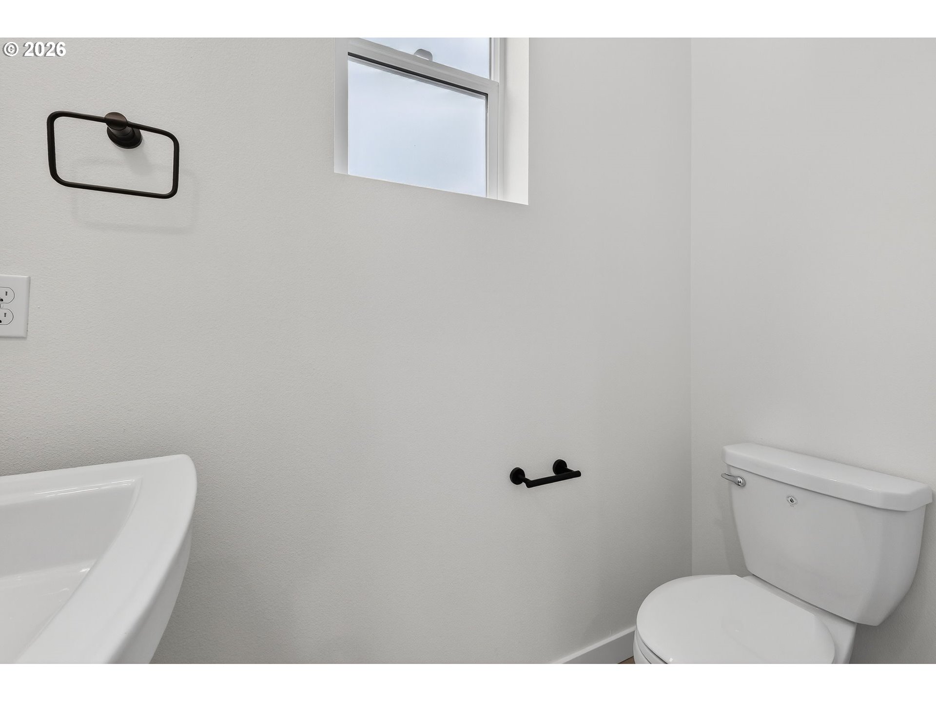 4059 Southwest McKinley Street, Unit 40 Gresham, OR 97080 - Photo 15 of 38 a bathroom with a toilet and a vanity
