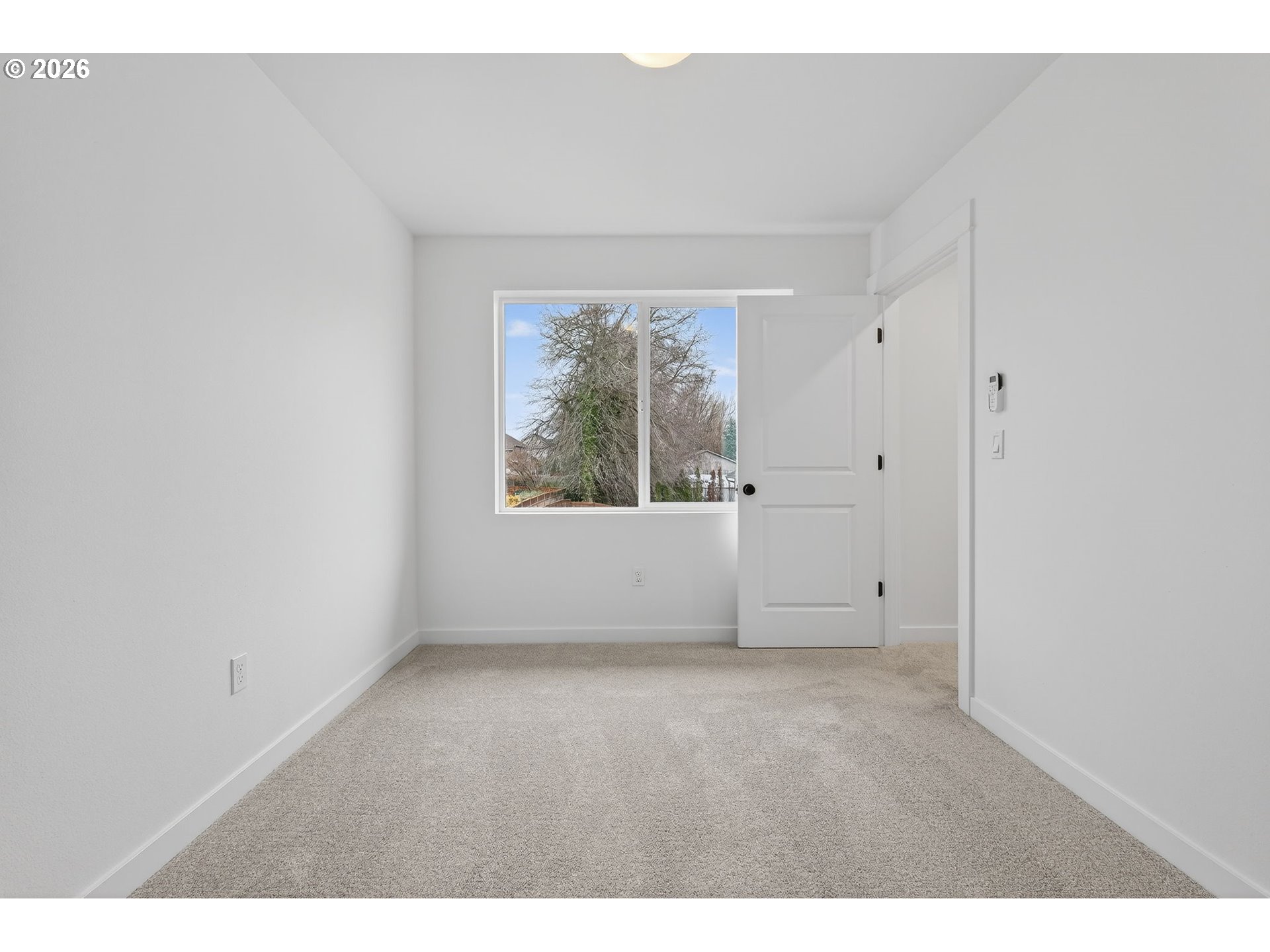 4059 Southwest McKinley Street, Unit 40 Gresham, OR 97080 - Photo 20 of 38 a view of an empty room with a window
