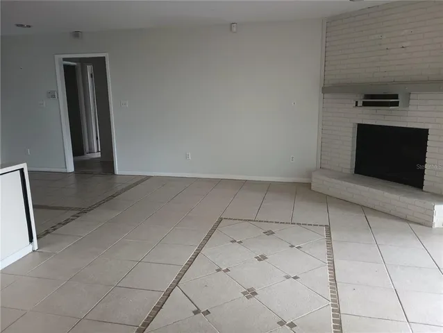 a view of a kitchen with a sink and a microwave