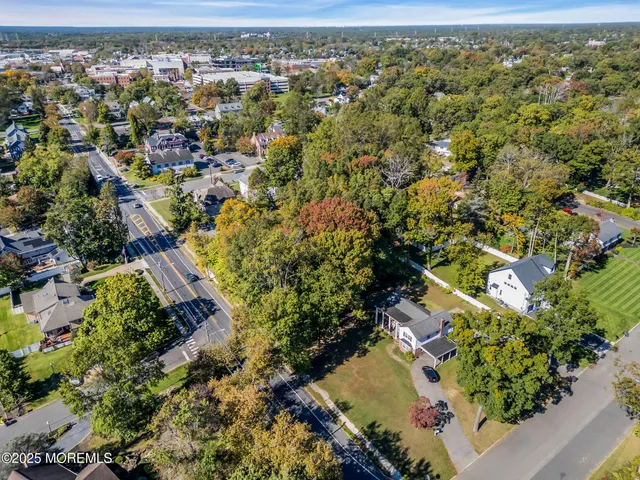 an aerial view of a residential houses with outdoor space