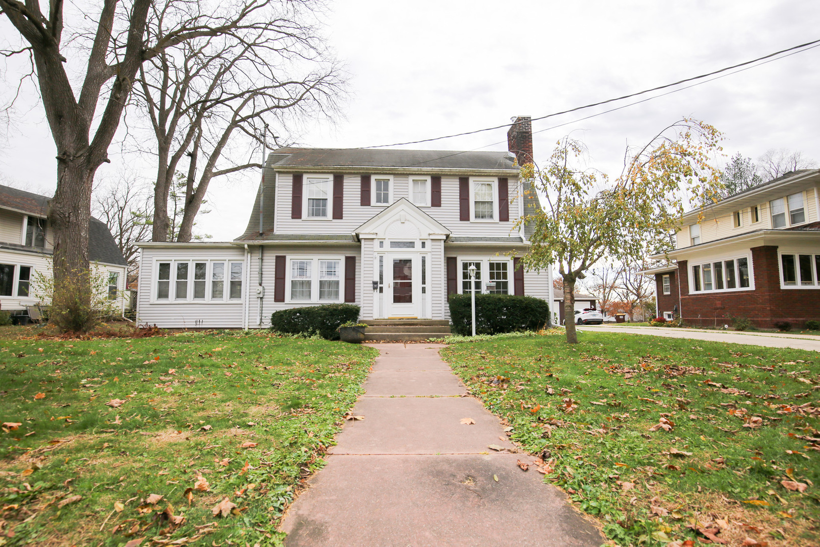 311 East Brayton Road Mount Morris, IL 61054 - Photo 1 of 1 a front view of a house with a garden and trees